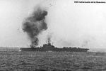 HMS Indomitable hit by kamikaze. This may have been the attack on April 1, 1945 off of Sakashima. THe ship was also hit by kamikazes on the May 4 and 9. Photo kindly supplied by Peter Bennett.