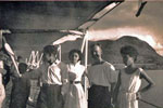 Visitors to the ship during the ship's Open Day, Port Victoria, Mauritius in 1955/56. Keith Butler is in this photo. Keith made friends with this family. The elder girl was a children's nurse who later took Keith and a telegraphist to her hospital where they sang with the children in French! Image from Keith Butler