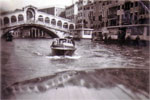 We hired two water taxis for a trip down The Grand Canal, Rialto Bridge, Venice, 1950. Photo from Alan Clements