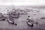 Fleet Carriers in Grand Harbour, Valletta, Malta around 1956. HMS Centaur (left) with tugs while HMS Albion (right) is moving slowly to the harbour entrance. They were en route to the Far East via the Suez Canal and Red Sea