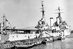 HMS Gambia tied up at Navy House Jetty, Port Said, Egypt, November 1951. Photo from Anne Irvine.