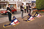 Standard Bearers at the War Memorial, Leamington Spa in 1992. Left to right: Ron Capers, Leamington Standard Bearer; Tony Hockenhull? HMS Gambia Association Standard Bearer; Alan Fletcher, Warwick Branch Standard Bearer. This photo was kindly submitted by Ian Frost of Leamington Spa RNA