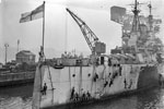 HMS Anson being painted by her crew on December 21, 1943 at Rosyth. Photo: Lt. E. A. Zimmerman. Imperial War Museums A 21080