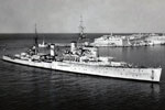 HMS Nigeria entering Malta. Built by Vickers Armstrong. Laid down February 8, 1938. Launched July 18, 1939. Completed September 23, 1940. Paid off 1950. In reserve 1950-1954, then sold to India. Recommissioned in 1957 and renamed Mysore. Decommissioned on August 20, 1985.