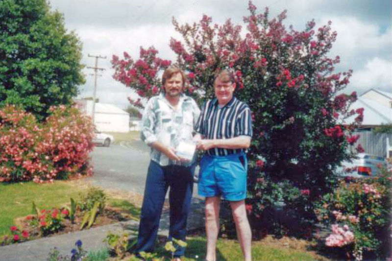 David Judge in New Zealnd with his copy of the book HMNZS Gambia by Jack S. Harker