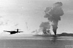 A Fairey Barracuda leaves huge fires, showing the success of the attack, as it returns from the raid. Operation Cockpit against Sabang, April 19, 1944. Imperial War Museums A 23250