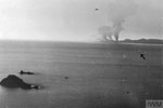 The arrow points to a British submarine under the command of Lieut. Cdr. A. F. Collett, DSC, RN, as it carries out the rescue of downed American Naval Airman Lieut Klahn, who was forced to land in the sea during the attack on Sabang. Operation Cockpit, April 19, 1944. Imperial War Museums A 23253