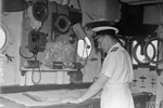 Admiral Sir James Somerville, C in C Eastern Fleet, on the Admiral's bridge of HMS Queen Elizabeth looks at the chart. Operation Cockpit against Sabang, April 19, 1944. Photo: Lt. C. Trusler. Imperial War Museums A 23480