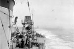 The Dutch cruiser Tromp astern of HMS Quilliam as Captain Onslow's forces withdraw at speed. Captain Onslow, DSO, RN led the attack force against Sabang. Operation Crimson, July 25, 1944. Photo: Lt. C. Trusler. Imperial War Museums A 25111
