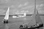 Off-duty RAF personnel enjoy some sailing at Koggala, Ceylon, as Short Sunderland GR Mark III, ML865 'J', of No. 230 Squadron RAF lies at its moorings during WWII. Imperial War Museums CI 881