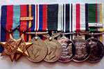 Laurie Carr’s medals. From left, the 1939–45 Star, the Burma Star with Pacific Clasp, the War Medal, New Zealand War Service Medal, NZ Operational Service Medal. NZ Service Medal, Cadet Forces Medal with clasp.