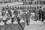 Mr Jordan, High Commissioner of New Zealand, inspecting divisions on the quarterdeck of HMS Gambia during the formal handing over in Liverpool, October 3, 1943. Behind him is the Commanding Officer of the ship, Captain N J W Willam-Powlett, DSC, RN. Photo: Lt. C. H. Parnall. Imperial War Museums A 19580